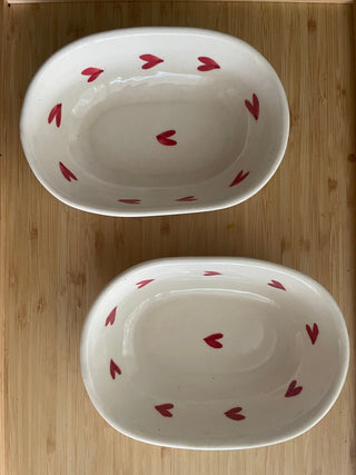 Pair of super cute oval ceramic bowls with hand-painted heart design. Shop unique gifting ideas in Bangalore, India.