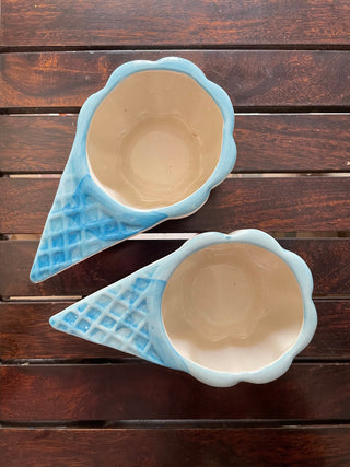 Top shot of 2 light blue ceramic ice cream bowls on wooden table, white glazed inside. Shop kitchenware in Bangalore.